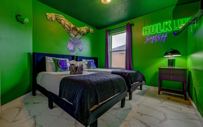 Hulk Smash Themed Bedroom – Kissimmee Vacation Home Rental Green Hulk themed twin bedroom with neon wall art at Marble Studios Florida in Kissimmee